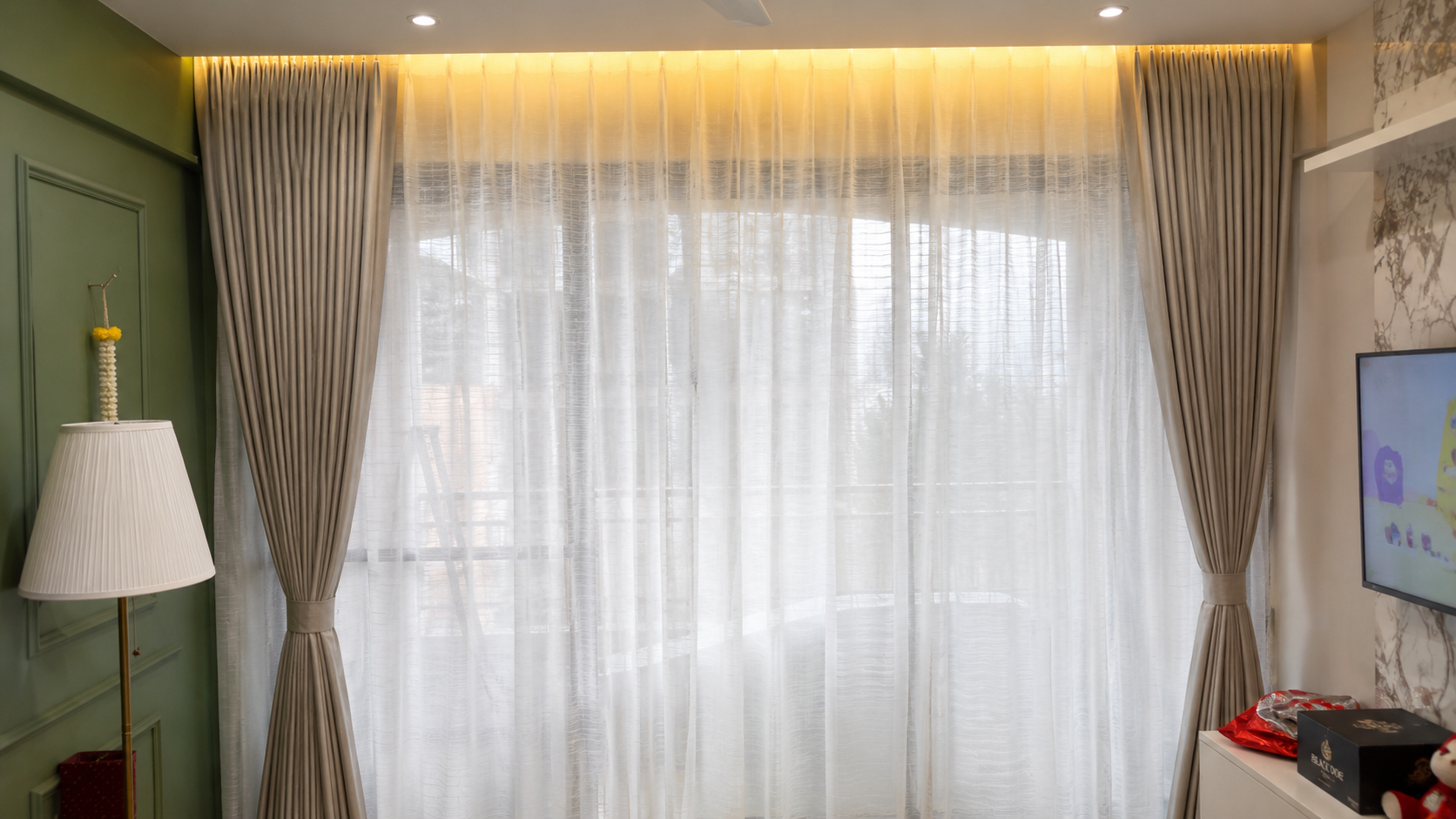 Beige drapes with sheer and LED cove - ARA Decor Studio Pune